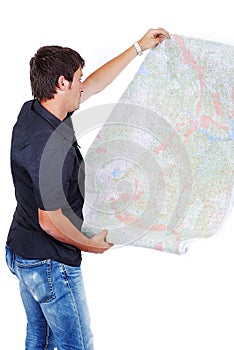 Man standing and looking at maps