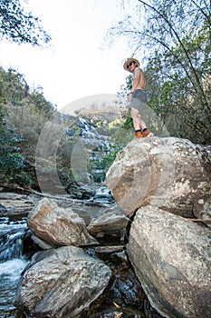 The man standing at Mae Ya Waterwall