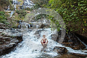 The man standing at Mae Ya Waterwall