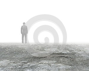 Man standing in mist on dirty concrete floor