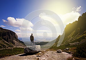 Man standing at the mountain top