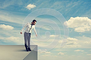 Man standing over the precipice photo