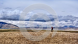 A man standing by the Peiku lake