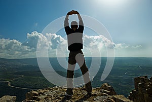 Man standing at the precipice photo