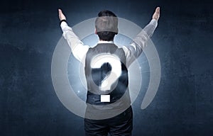 Man standing with question mark on his back
