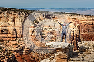 Man standing on a rock at the Cold Shivers Overlook, Colorado