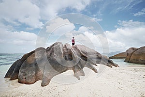 Man standing on rock and looking at view