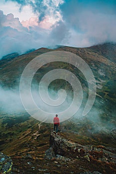 Man standing on the rocks somewhere in carpathian mountains.