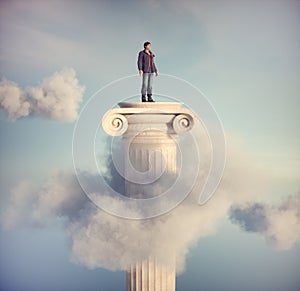 Man standing on a Roman column