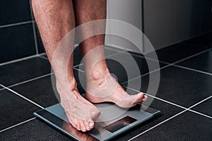 Man standing on a scale