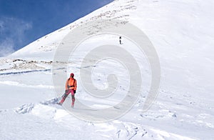 Man standing in a snowed slope