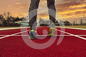 Man standing on the start line in the sports ground