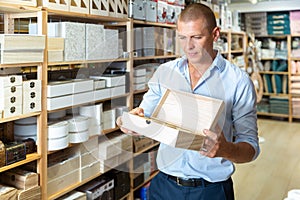 Man with sundries storage box photo