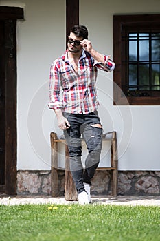 Man Standing Strong Outdoors in Nature Posing