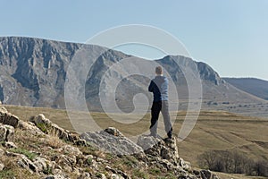 Man standing on top of mountain