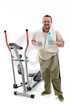 Man standing by a training device resting