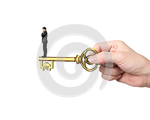 Man standing on treasure key in Euro sign shape