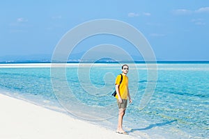 Man standing on tropical paradise beach, Okinawa, Japan