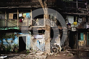 Man standing on verandah at old building in Wadas of Pune, India