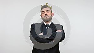 Man standing wearing gold crown, self-loving egoism concept.