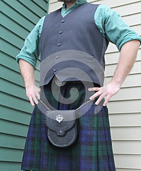 Man standing wearing Scottish kilt