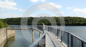 Man stands on the bridge 