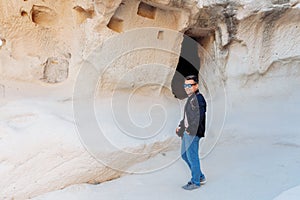 A man stands at the cave. Cappadocia Turkey.