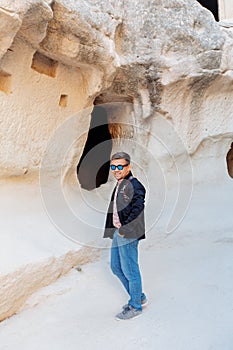 Man stands at the cave. Cappadocia Turkey.