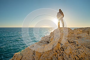 Man stands on the edge of the abyss photo