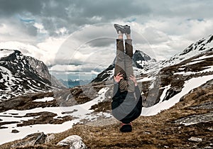 A man stands on his head tonned photo