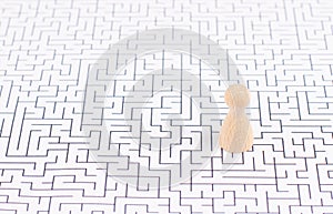 Man stands in the middle of a labyrinth, searching for a solution to exit, finding a strategy, challenge and problem solving