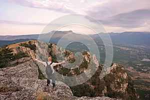 Man stands on the top of the Southern Demerdzhi Mountain in Crimea photo