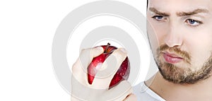 Man staring at an apple