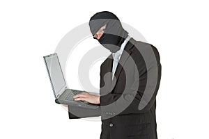 Man stealing data from a laptop