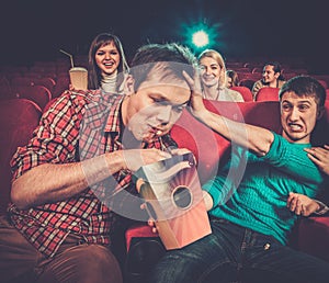 Man steals popcorn in cinema