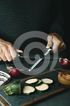 man steeling a kitchen knife
