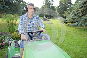 man steering mower