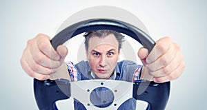 Man with a steering wheel, front view. Driver car concept
