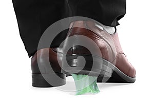 Man stepping into chewing gum on white background, closeup