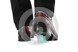 Man stepping into chewing gum on white background, closeup