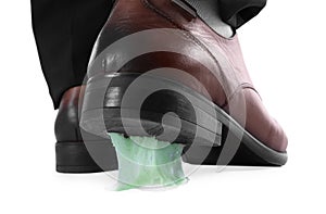 Man stepping into chewing gum on white background, closeup