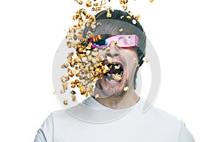 Man in stereo glasses eating popcorn