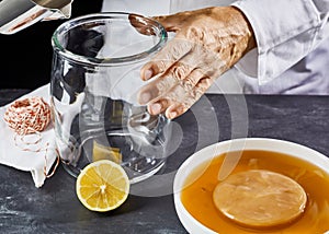 Man sterilising a glass container to make kombucha
