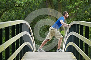 Man Stetching Muscles Outdoors