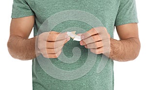 Man with sticking plaster on white background