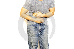 Man with stomach pain hand holding his aching belly isolated.