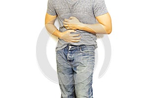 Man with stomach pain hand holding his aching belly isolated.