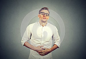 Man with stomach pain indigestion photo