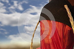 Man with strange headdress and veil