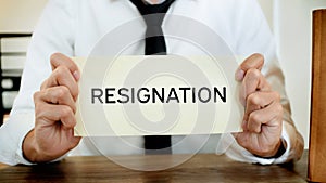 Man stressing with resignation letter for quit a job photo